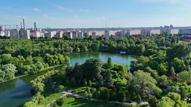 Aerial Perspective of Green Urban Park with Lake and Industrial City Context