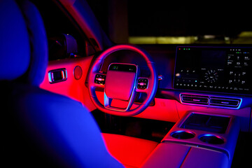 Fototapeta premium luxurious car interior stationary in parking lot with leather and plastic materials, modern and serene perspective from driver's seat, black and gray tones, automotive design and luxury.