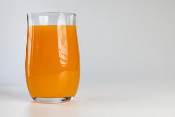 Glass of fresh orange juice isolated on white background © Ruslan