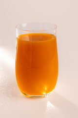 Glass of fresh orange juice isolated on white background © Ruslan