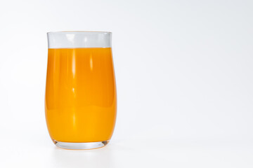 Glass of fresh orange juice isolated on white background © Ruslan