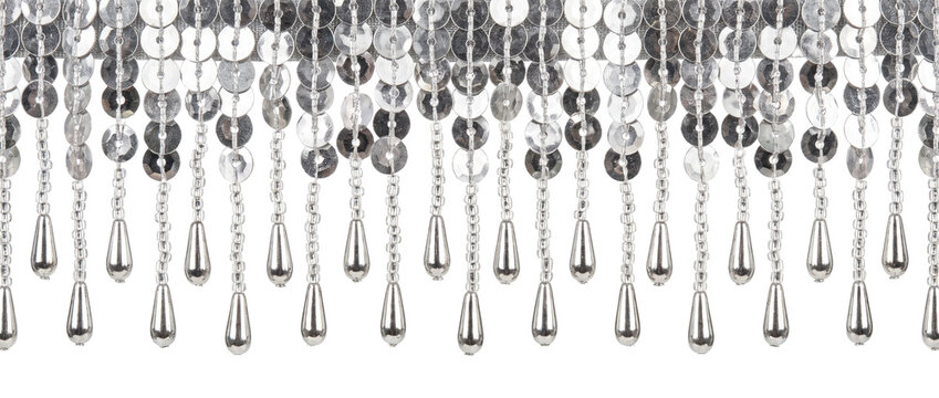 Silver sequin fringe trim beaded hanging garment border on black background for fashion sewing, costume design, and craft decoration, featuring shiny metallic teardrop tassels for sparkling party look