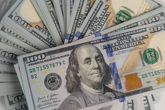 Close up shot of one hundred US dollar banknotes fanned out
