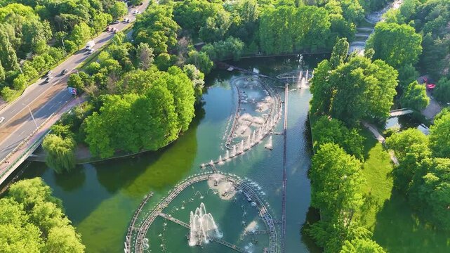 Aerial View of Dancing Water Fountains in Scenic Urban Park Lake