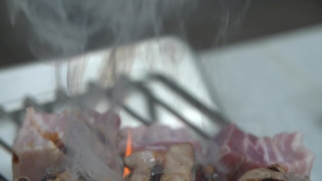 Pork belly charcoal BBQ grilled meat pork flame fire smoke k food traditional meat cooking recipe restaurant food ingredient 통돼지삼겹살 구이 삼겹살 돼지고기 숯불구이 한식 케이푸드 석쇠 불 고기 숯불 연기 불꽃 식재료 요리 음식 돼지구이 바비큐 직화구이