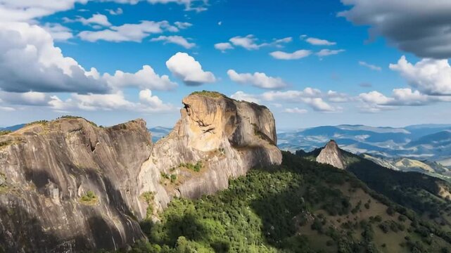 Pedra do Ba&uacute; in S&atilde;o Bento do Sapuca&iacute; in aerial view. Rock climbing site. Atlantic Forrest. Time lapse.