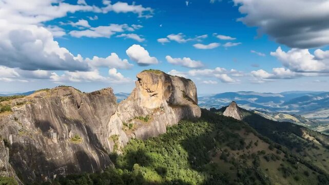 Pedra do Ba&uacute; in S&atilde;o Bento do Sapuca&iacute; in aerial view. Rock climbing site. Atlantic Forrest. Time lapse.