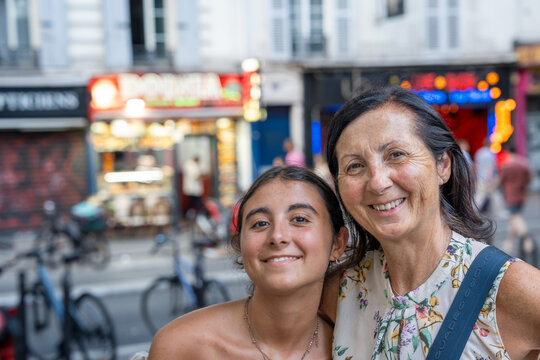 Tourists sightseeing in Pigalle Paris vibrant neighborhood.