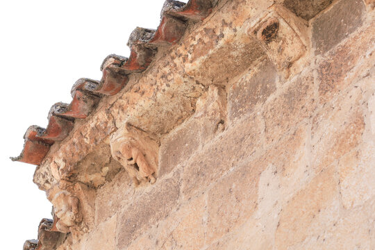 Corbels on the cornice of Saint Claudius of Olivares church in Zamora city, Spain