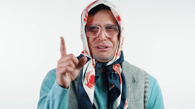 Funny old grandmother waving her index finger to teach a moral lesson