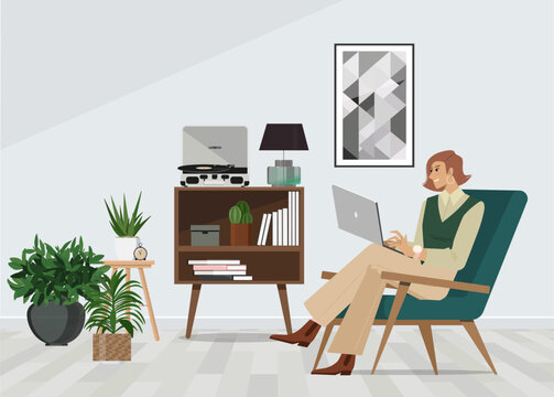 A freelancer person works behind a laptop. Coworking space workplace.