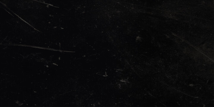 Black scratched and distressed wall surface with white marks and scratches texture background