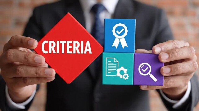 Businessman holding criteria blocks with icons for quality process and search in a studio setting