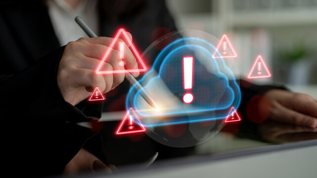 Red alert triangles over a blue cloud icon, symbolizing cloud security threats, system warnings, and data protection risks in digital environments Parse