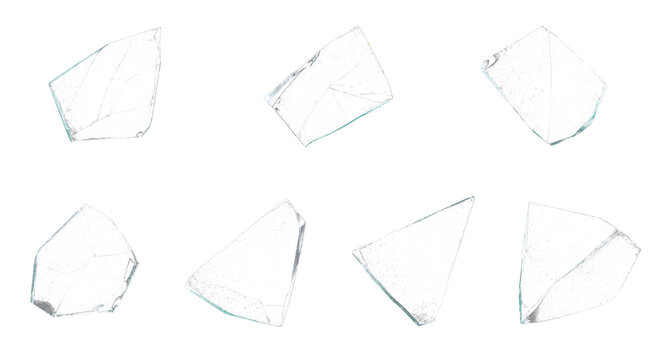 Broken glass shards collection on white background, set of seven transparent glass fragments, sharp shattered glass pieces for design overlays