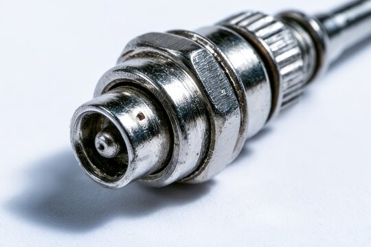 Isolated metal BNC RF connector with soft shadow on white surface