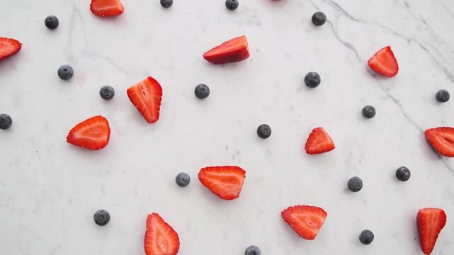 sliced raspberries, blackberries, white background, fresh fruit, red berry, dark berries, sliced fruit, berry arrangement, food photography, studio shot, bright lighting, clean presentation, top view 