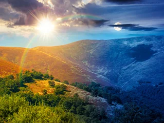 carpathian mountain landscape. travel ukraine on summer solstice. slopes mountain ridge in august at twilight. wonderful carpathian adventure with sun and moon on epic sky © Pellinni
