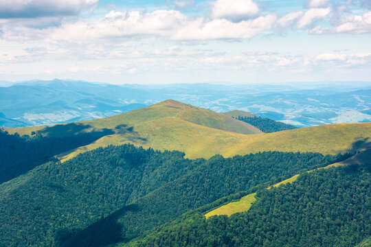 beautiful mountain landscape in summer. travel ukraine background. rolling hill in dappled light. scenic view of borzhava ridge. carpathian mountain scenery