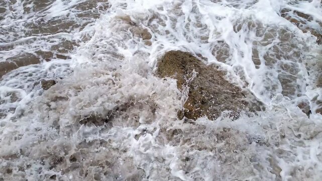 Ocean waves crashing against rock. Tidal waves hitting the stones. Dramatic coastal seascape and power of nature.