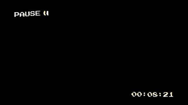 VCR playing and pausing a VHS blank tape with noise overlay. Alpha channel 4K video