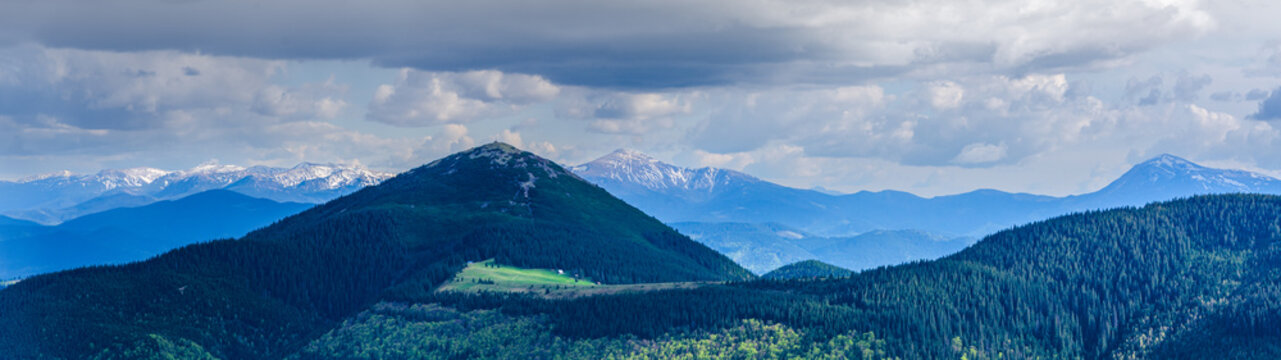 Beautiful view of Mount Khomiak peak and distant snowy ridge from Gorgany mountains Carpathians