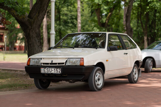 Lada Samara 1300 Sputnik (VAZ-2108) - front angle view of a vintage light beige (white) soviet iconic 1980s car standing on a brick walkway in Palic, Serbia on July 5, 2026