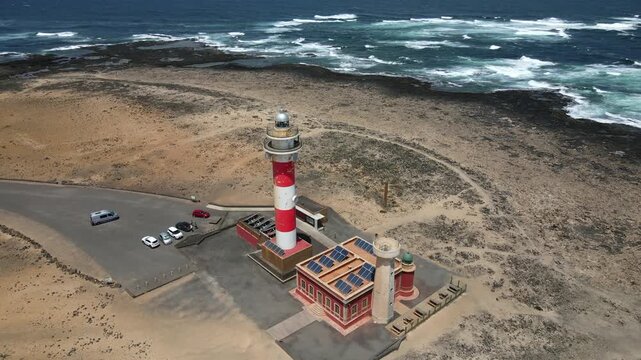 Breathtaking aerial footage showing the iconic Toston lighthouse in El Cotillo. The landmark stands proudly on the volcanic coastline of Fuerteventura