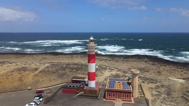 Rocky coastline surrounding the Toston lighthouse in El Cotillo, Fuerteventura. An aerial shot showing the beautiful canary seascape