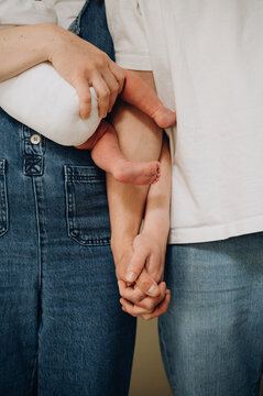 parents are holding each other hands  