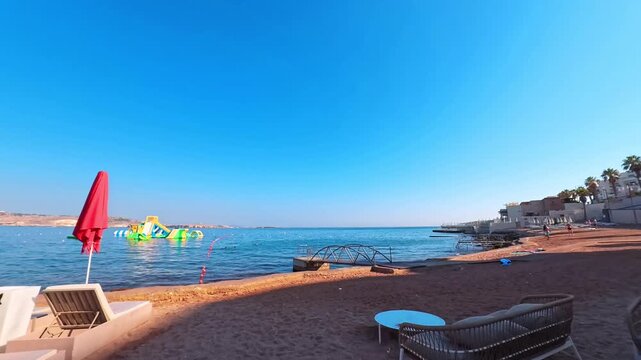 Passing By Sun Loungers on Mediterranean Beach, Bugibba, Malta - POV VIDEO - NO AUDIO