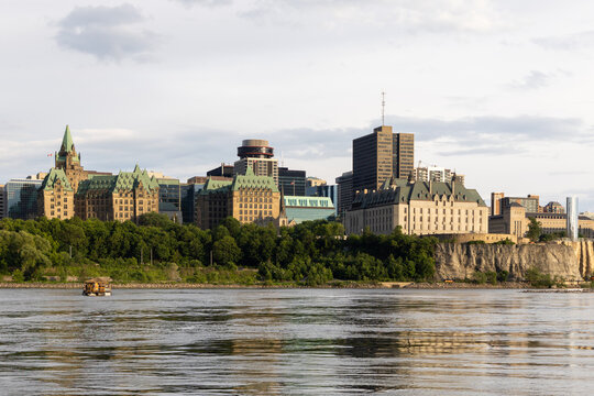 Ottawa skyline panoramas showing historic buildings over river.