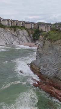 Aerial view of secluded cove between flysch cliffs, Basque Country, Spain