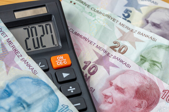 Turkiye money. Finances 2027. Business and economic concept. Symbol of the TRY.  The year 2027 displayed on a calculator. Financial background. Close up on Turkish Lira