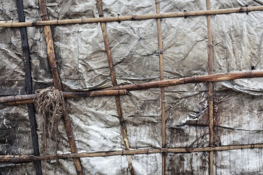 Detail of a makeshift dwelling made of plastic sheeting and bamboo sticks, Tejgaon Slum Area, Dhaka, Bangladesh