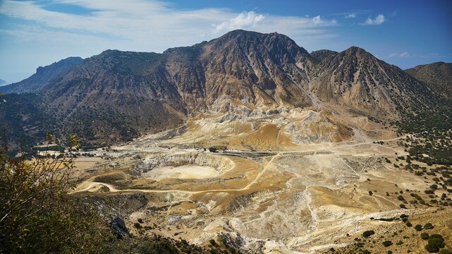 Large-scale volcanic landscape with geological diversity and majestic mountains under a wide sky, volcanism, volcanic island, Nikia viewpoint, Nisyros, Dodecanese, Greek islands, Greece