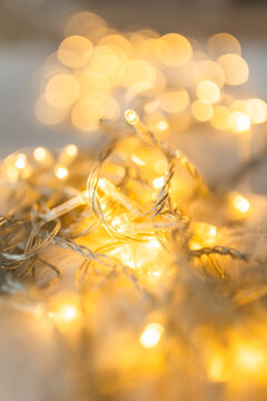 Soft focus abstract background of warm golden Christmas lights with beautiful bokeh.