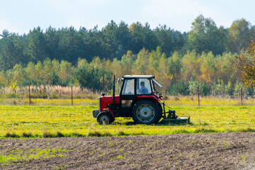 Fototapeta premium Tractor with a Mounted Mower