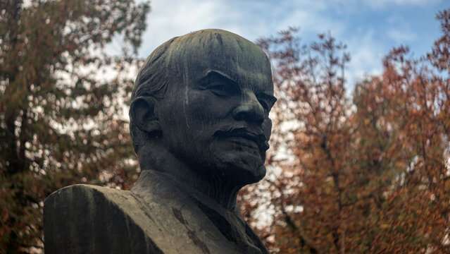 Bronze Statue of Vladimir Lenin in Autumn Park Close Up