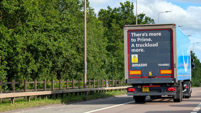 Leicester, England, UK - 18 June 2026: Amazon prime delivery semi trailer truck driving on road, rear view of cargo lorry transporting freight on highway, commercial distribution supply chain