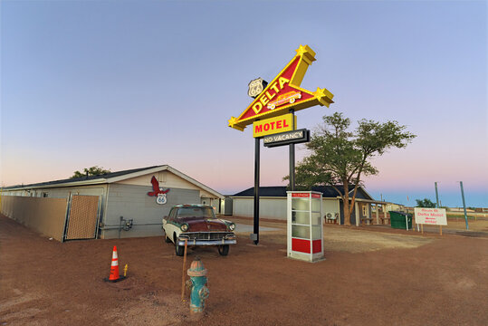 Vintage Route 66 motel with retro neon sign at dawn, Winslow, Arizona, 2025.