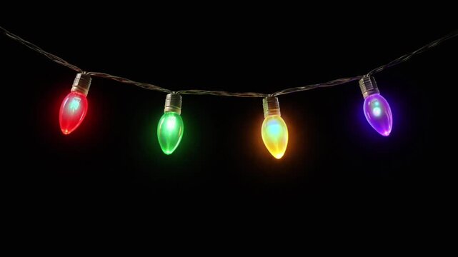 colorful christmas string lights decoration hanging on black background
