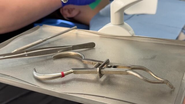 Dental instruments on sterile tray prepared for dental treatment in modern clinic with clean medical tools ready for patient examination and procedure