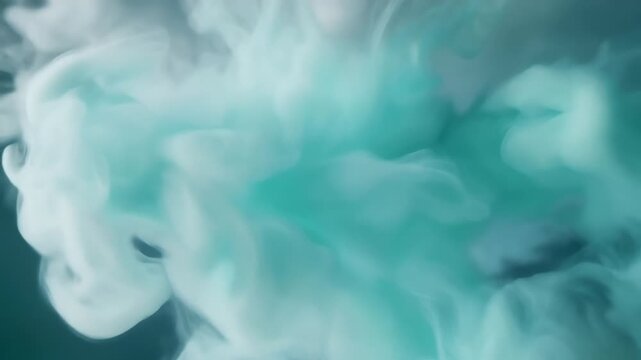 Teal and white smoke swirls against a pale blue background, forming soft abstract cloud shapes that feel ethereal and dreamlike, with diffused edges and a tranquil, immersive atmosphere. Calm mood..