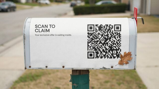 QR code sticker with 'Scan to Claim' text on a weathered metal mailbox in a suburban setting