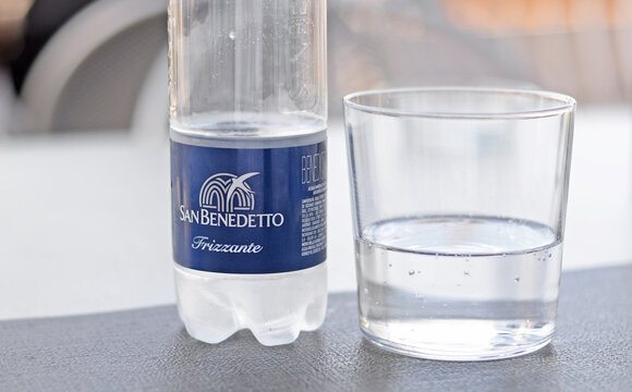 STRESA, ITALY &ndash; MAY 2, 2026:  Glass and plastic bottle of San Benedetto sprakling water, an Italian mineral brand produced near Venice. Selective focus