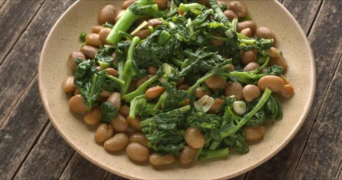 Broccoli rabe (rapini) with beans. Traditional Tuscan dish.