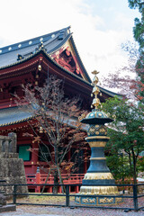 Obraz premium Traditional Japanese Temple with Ornate Golden Lantern and Autumn Foliage in Nikko, Japan