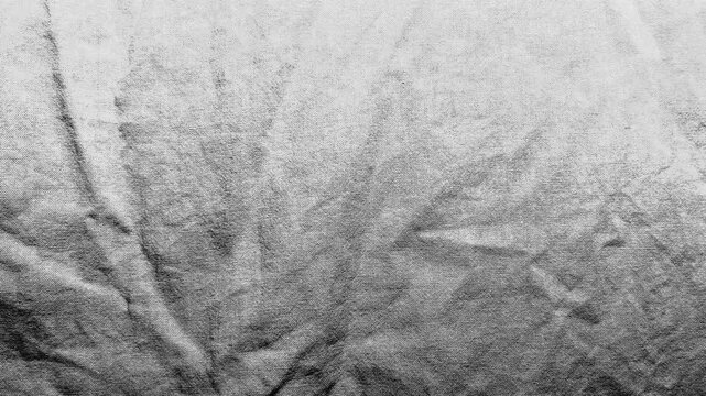 textured monochrome linen fabric displays rustic creasing and organic folding in a minimalist design