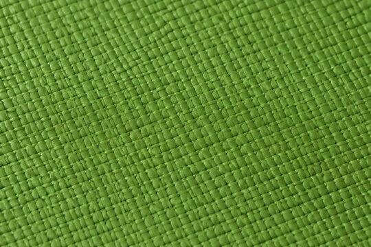Detailed Extreme Macro Texture Shot Displaying Green Rubber Yoga Mat Surface With Grip Pattern Background